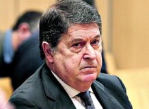 José Luis Olivas Martínez en un evento formal, con expresión seria.