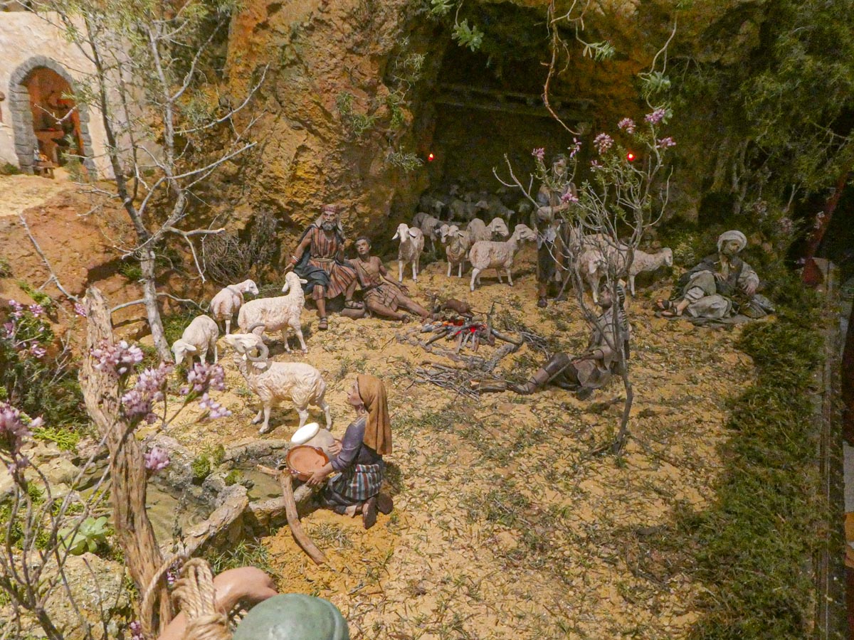 Representación de pastores y ovejas en un paisaje rural