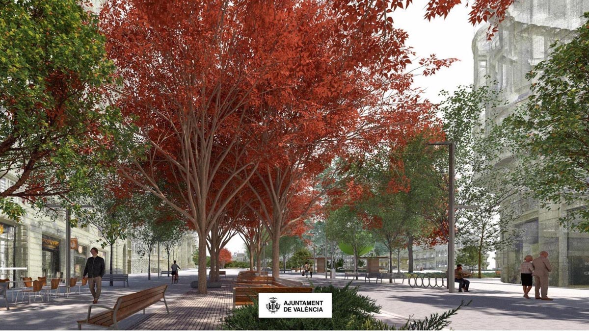 Vista de la reurbanización de la plaza del Ayuntamiento en Valencia con árboles rojos.