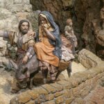 Figuras artesanales de la natividad con un burro y personajes bíblicos.