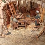 Grupo de personas trabajando en un taller antiguo con herramientas