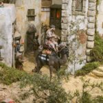 Representación de una escena navideña con figuras en un paisaje