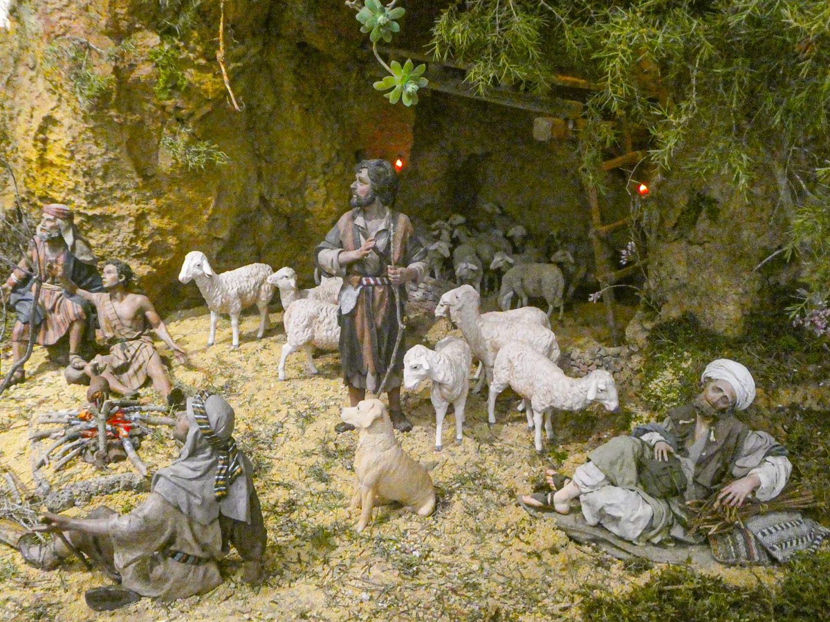 Escena de pastores con ovejas en un entorno natural