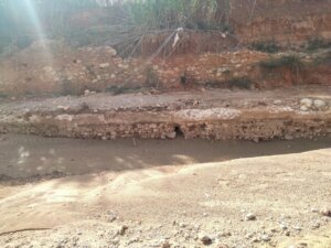 Tramo de la acequia medieval del Reg Mil·lenari en Torrent descubierto tras la DANA