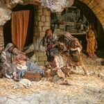 Escena del nacimiento de Jesús en un pesebre con figuras de barro.