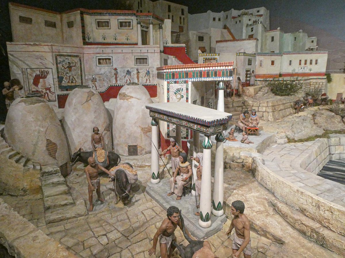 Recreación de una civilización antigua con figuras humanas y arquitectura.