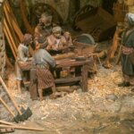 Escena de un taller con artesanos trabajando la madera