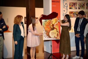 Presentación del cartel de las Fallas de Torrent 2026 en un evento cultural.