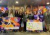 Presentación de la carrera 10KFem en Valencia con participantes y carteles