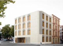 Edificio del Espai Dones i Igualtat en Valencia con árboles alrededor.