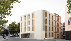 Edificio del Espai Dones i Igualtat en Valencia con árboles alrededor.