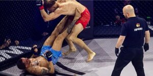 Luchadores en combate durante evento de MMA en Roig Arena